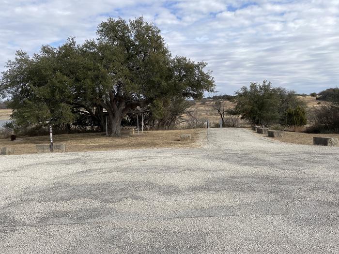 A photo of Site 102 of Loop 1 at FLATROCK (TEXAS) with Picnic Table, Electricity Hookup, Fire Pit, Shade, Water Hookup