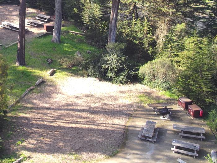 One campsite surrounded by trees. The Yunahia campsite pictured from above.