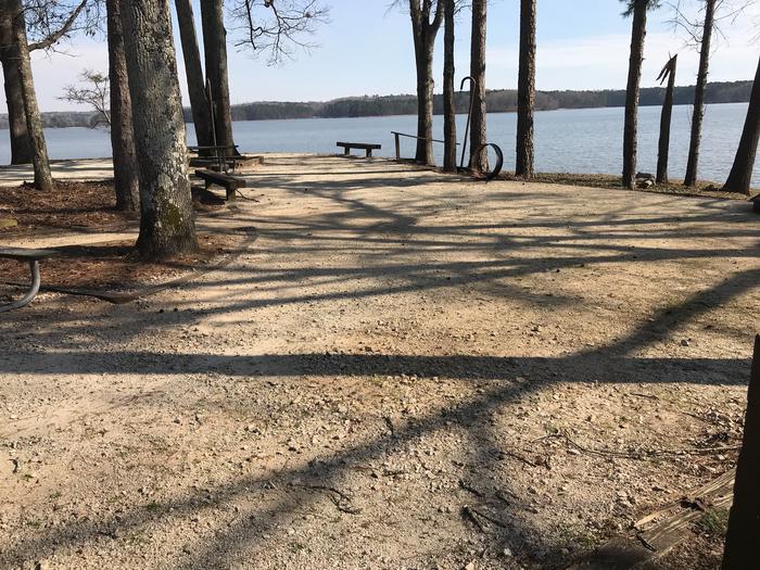 A photo of Site 56 of Loop LOOG at WHITETAIL RIDGE with Picnic Table, Electricity Hookup, Fire Pit, Shade, Tent Pad, Waterfront, Lantern Pole, Water Hookup