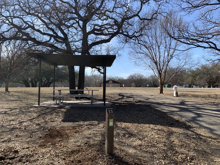 A photo of Site 033 of Loop SOUT at Holiday (Texas) with Picnic Table, Electricity Hookup, Shade, Water Hookup