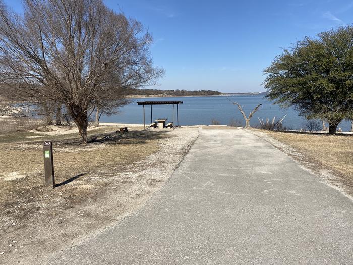 A photo of Site 050 of Loop SOUT at Holiday (Texas) with Picnic Table, Fire Pit, Waterfront