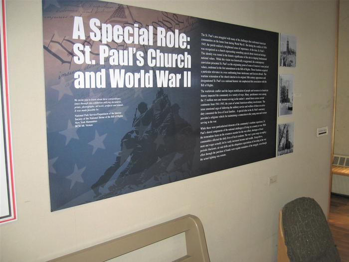 Soldiers planting a flag on a mountain topOpening panel of the feature exhibition in the museum, "A Special Role: St. Paul's Church and World War II" 