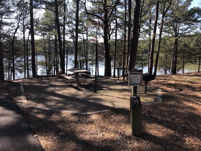 A photo of Site 055 of Loop NORTH SHORE at CEDAR LAKE (OKLAHOMA) with Picnic Table, Fire Pit, Shade, Waterfront, Lantern Pole