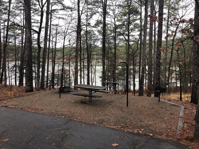A photo of Site 056 of Loop NORTH SHORE at CEDAR LAKE (OKLAHOMA) with Picnic Table, Fire Pit, Tent Pad