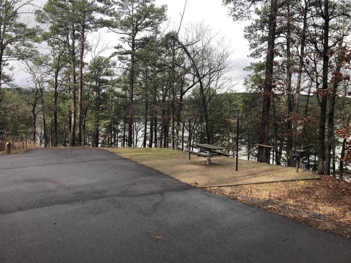 A photo of Site 059 of Loop NORTH SHORE at CEDAR LAKE (OKLAHOMA) with Picnic Table, Fire Pit, Tent Pad, Lantern Pole