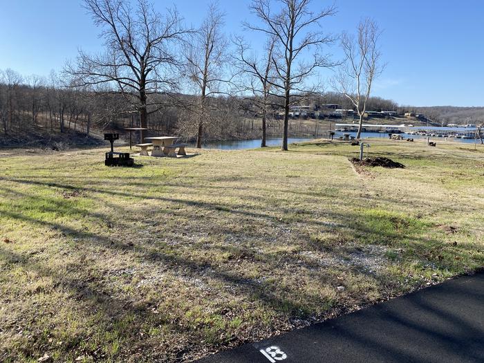 A photo of Site 018 of Loop SCRE at SNAKE CREEK with Picnic Table, Electricity Hookup, Fire Pit, Waterfront, Lantern Pole, Water Hookup