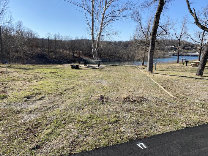 A photo of Site 017 of Loop SCRE at SNAKE CREEK with Picnic Table, Electricity Hookup, Fire Pit, Shade, Waterfront, Lantern Pole, Water Hookup
