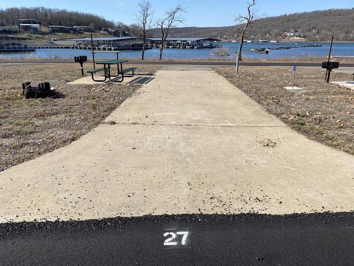 A photo of Site 027 of Loop SCRE at SNAKE CREEK with Picnic Table, Electricity Hookup, Fire Pit, Waterfront, Lantern Pole, Water Hookup