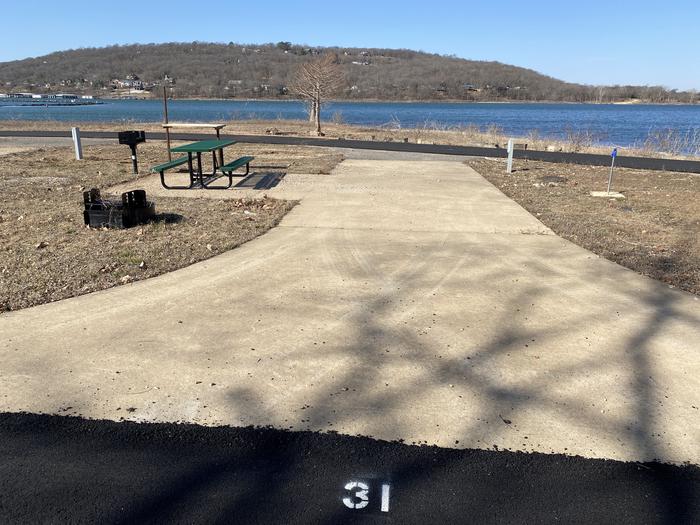 A photo of Site 031 of Loop SCRE at SNAKE CREEK with Picnic Table, Electricity Hookup, Fire Pit, Waterfront, Lantern Pole, Water Hookup