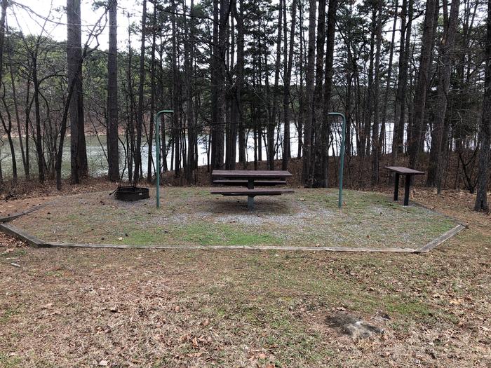 A photo of Site 035 of Loop SANDY BEACH at CEDAR LAKE (OKLAHOMA) with Picnic Table, Fire Pit, Shade, Tent Pad