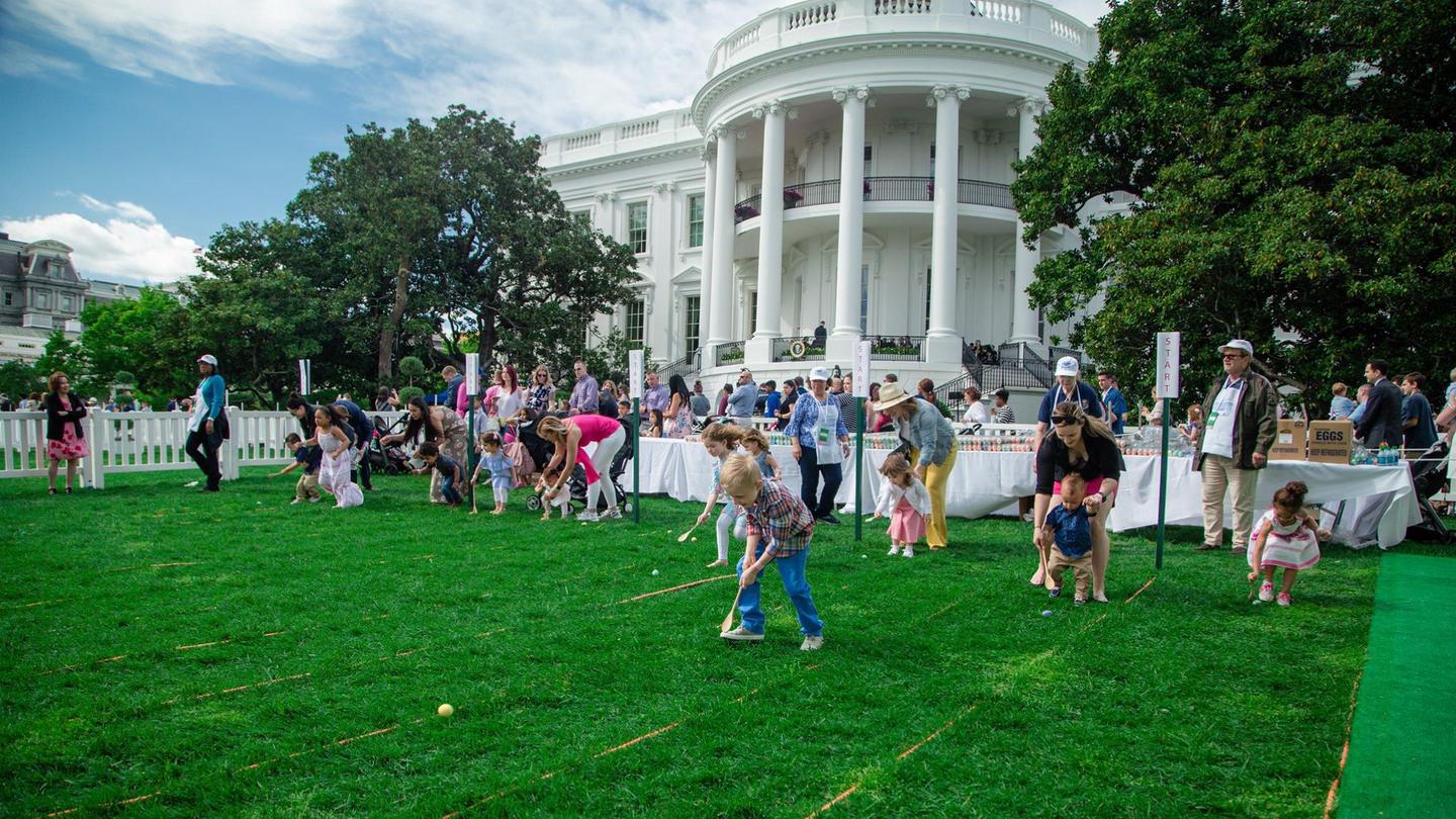 Guests attend the White House Easter Egg Roll, on the South Lawn of the White House. 