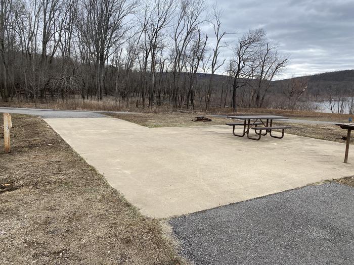 A photo of Site 100 of Loop CHICKEN CREEK  at CHICKEN CREEK with Picnic Table, Electricity Hookup, Fire Pit, Waterfront, Water Hookup