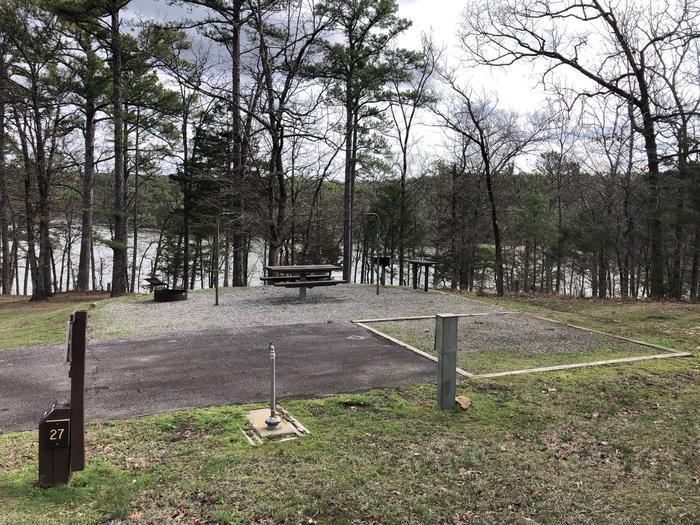 A photo of Site 027 of Loop SANDY BEACH at CEDAR LAKE (OKLAHOMA) with Picnic Table, Electricity Hookup, Fire Pit, Tent Pad, Lantern Pole, Water Hookup