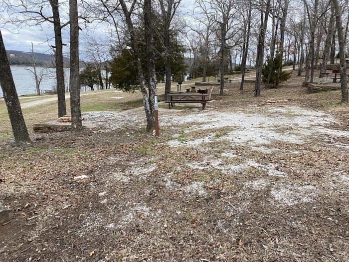 A photo of Site 105 of Loop 0512 at COOKSON BEND with Picnic Table, Fire Pit, Shade, Water Hookup