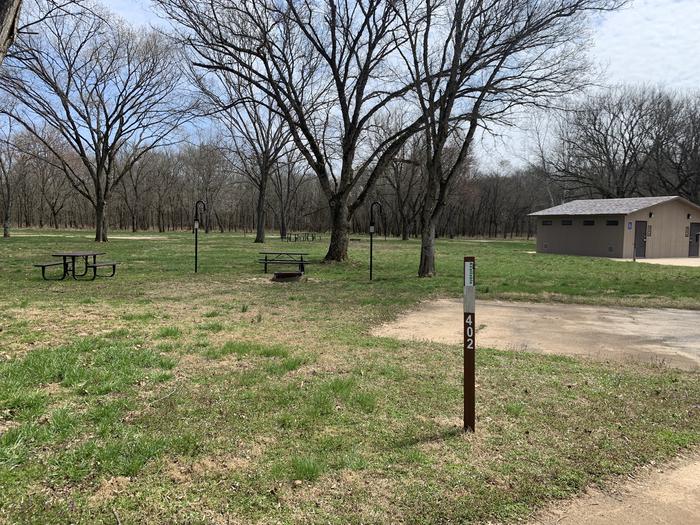 A photo of Site 402 of Loop Loop 400 at ALLEY SPRING with Picnic Table, Fire Pit, Lantern Pole