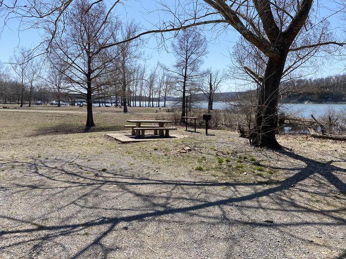 A photo of Site A28 of Loop PBAI at PETTIT BAY with Picnic Table, Fire Pit, Shade, Waterfront, Water Hookup
