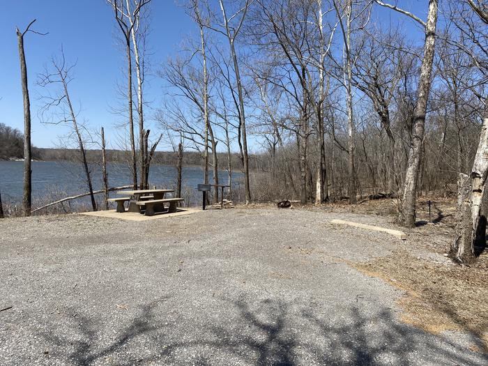 A photo of Site A34 of Loop PBAI at PETTIT BAY with Picnic Table, Fire Pit, Shade, Waterfront, Water Hookup