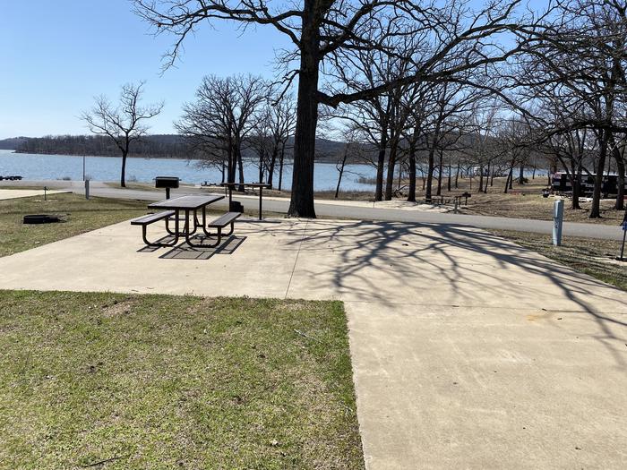 A photo of Site 12 of Loop PBA2 at PETTIT BAY with Picnic Table, Electricity Hookup, Fire Pit, Water Hookup