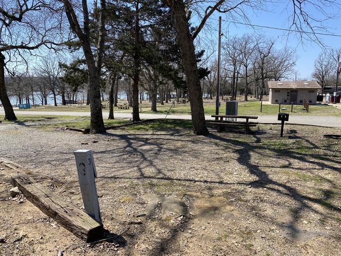 A photo of Site 03 of Loop PBA2 at PETTIT BAY with Picnic Table, Electricity Hookup, Fire Pit, Shade, Water Hookup