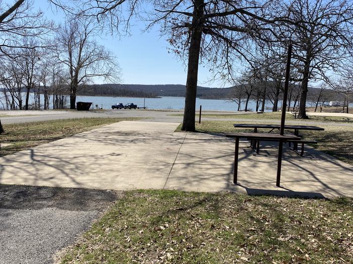 A photo of Site 10 of Loop PBA2 at PETTIT BAY with Picnic Table, Electricity Hookup, Fire Pit, Shade, Water Hookup