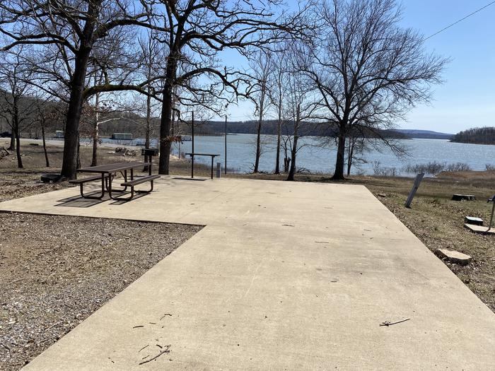 A photo of Site 20 of Loop PBA2 at PETTIT BAY with Picnic Table, Electricity Hookup, Fire Pit, Waterfront, Water Hookup