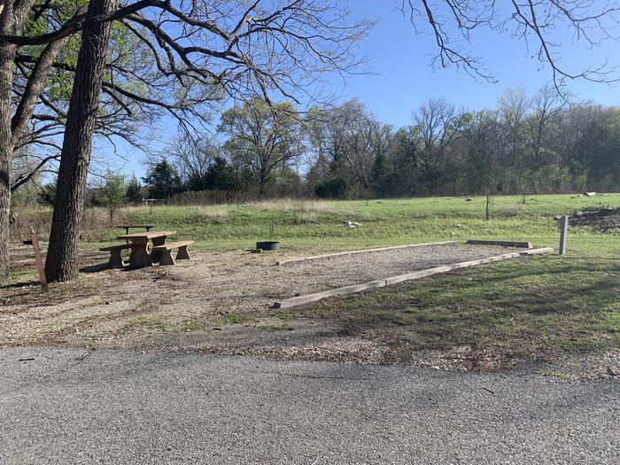 A photo of Site 4 of Loop A at Damsite Texas with Picnic Table, Fire Pit, Shade, Water Hookup