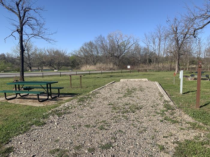 A photo of Site 15 of Loop A at Damsite Texas with Picnic Table, Electricity Hookup, Fire Pit, Water Hookup