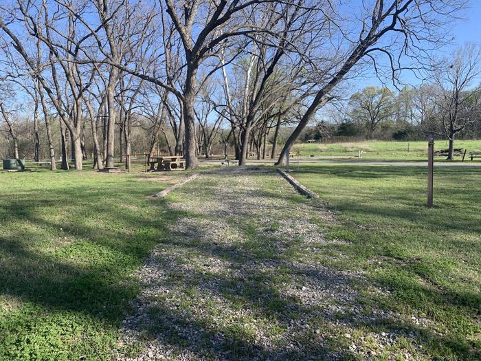 A photo of Site 16 of Loop A at Damsite Texas with Picnic Table, Electricity Hookup, Fire Pit, Water Hookup