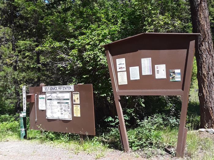 Trout Creek Campground self service fee station and information board.