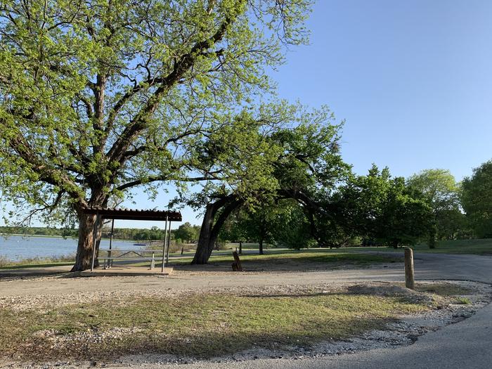 A photo of Site 064 of Loop HOLIDAY CAMPGROUND at Holiday (Texas) with Picnic Table, Shade, Water Hookup
