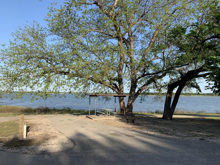 A photo of Site 064 of Loop HOLIDAY CAMPGROUND at Holiday (Texas) with Picnic Table, Shade, Water Hookup