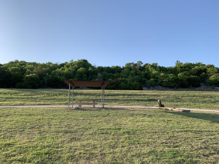 A photo of Site 070 of Loop HOLIDAY CAMPGROUND at Holiday (Texas) with Picnic Table, Fire Pit, Shade