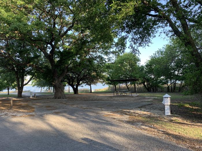 A photo of Site 074 of Loop HOLIDAY CAMPGROUND at Holiday (Texas) with Picnic Table, Electricity Hookup, Fire Pit, Waterfront