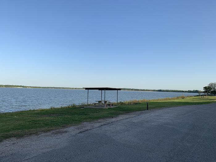 A photo of Site 082 of Loop HOLIDAY CAMPGROUND at Holiday (Texas) with Picnic Table, Fire Pit, Waterfront