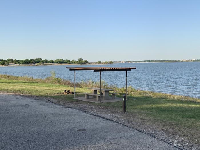 A photo of Site 080 of Loop HOLIDAY CAMPGROUND at Holiday (Texas) with Fire Pit, Shade, Waterfront