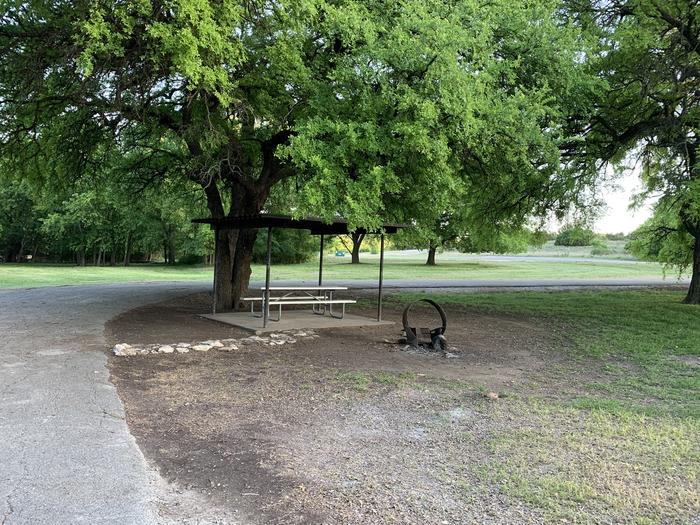 A photo of Site 100 of Loop HOLIDAY CAMPGROUND at Holiday (Texas) with Picnic Table, Fire Pit, Shade