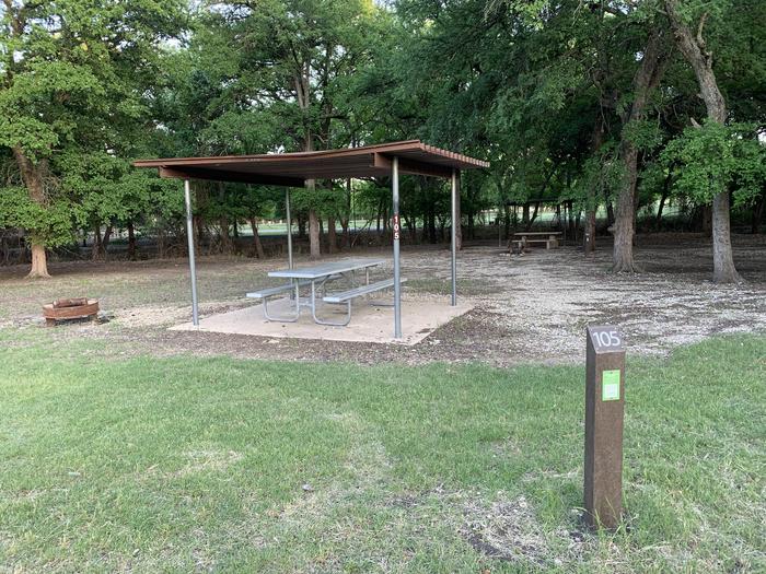 A photo of Site 105 of Loop HOLIDAY CAMPGROUND at Holiday (Texas) with Picnic Table, Fire Pit, Shade