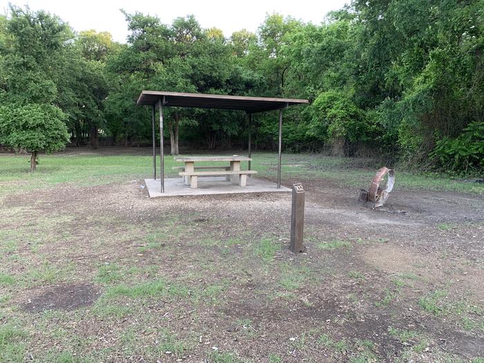 A photo of Site 102 of Loop HOLIDAY CAMPGROUND at Holiday (Texas) with Picnic Table, Fire Pit, Shade