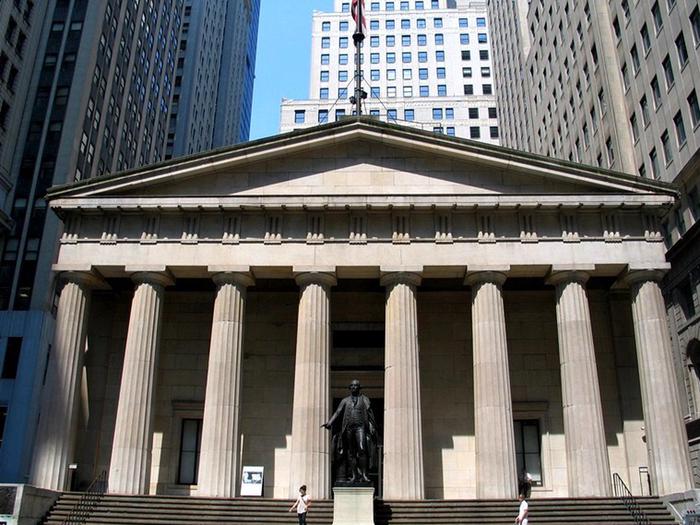This is a colored photo of Federal Hall National Memorial.On the site  of Federal Hall National Memorial, George Washington took the oath to become the first president of the  United States. 