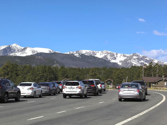Vehicles are lined up to enter Rocky Mountain National Park