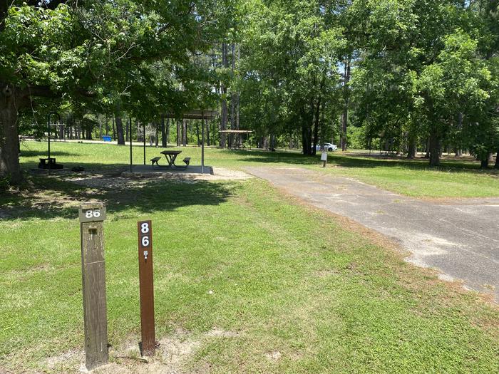 A photo of Site 086 of Loop A at MILL CREEK (TEXAS) with Picnic Table, Electricity Hookup, Fire Pit, Lantern Pole, Water Hookup