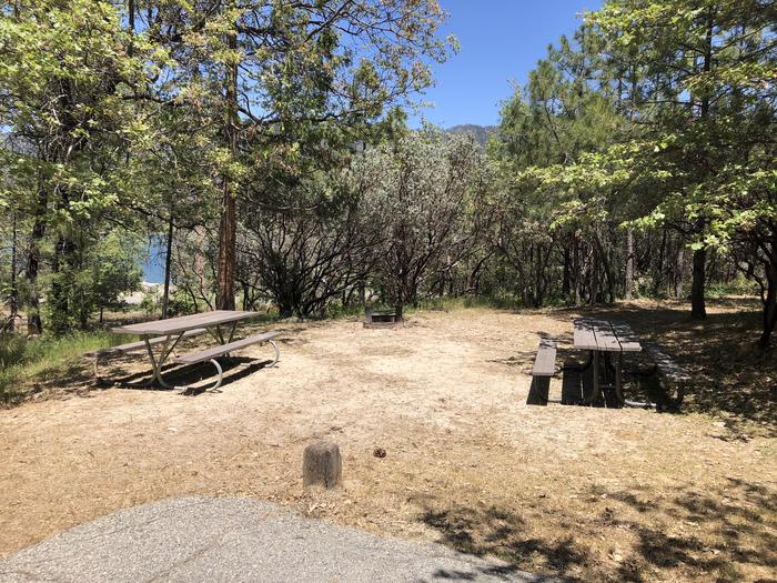 A photo of Site 011 of Loop 08-17 at CEDAR BLUFF with Picnic Table, Fire Pit, Shade, Tent Pad