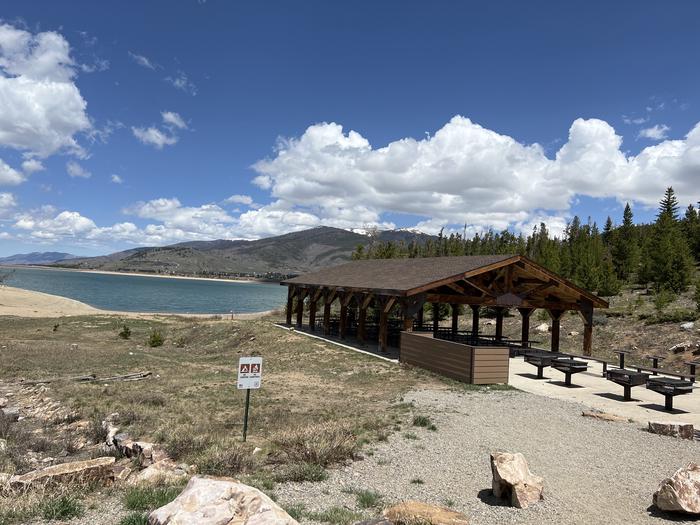 A photo of Site 2 of Loop LAKE at WINDY POINT GROUP (CO) with Picnic Table, Fire Pit, Shade, Waterfront