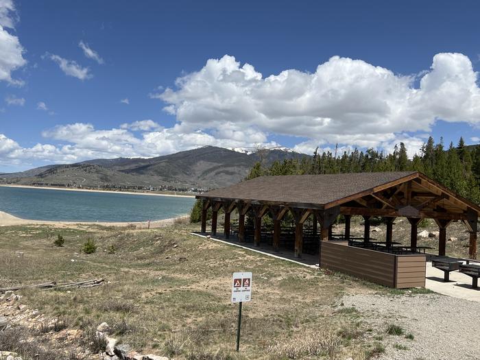 A photo of Site 2 of Loop LAKE at WINDY POINT GROUP (CO) with Picnic Table, Fire Pit, Shade, Waterfront, Lean To / Shelter
