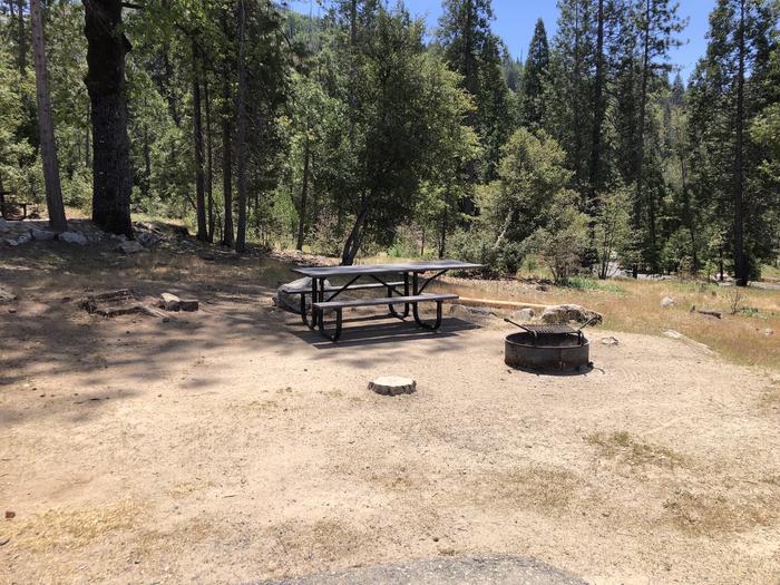 A photo of Site 023 of Loop FORKS CAMPGROUND at Forks Campground (Sierra) with Picnic Table, Fire Pit, Shade, Tent Pad