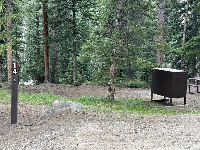 A photo of Site 14 of Loop GORE CREEK CAMPGROUND at GORE CREEK CAMPGROUND with Picnic Table, Shade, Food Storage, Tent Pad, Waterfront