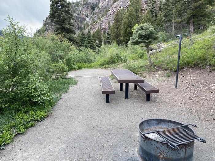 A photo of Site 034 of Loop AMPHITHEATER  at AMPHITHEATER (CO) with Picnic Table, Fire Pit, Tent Pad, Lantern Pole