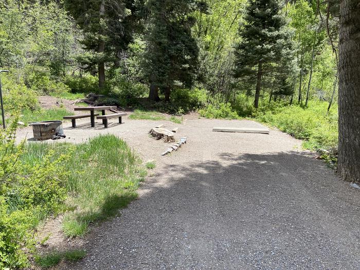A photo of Site 004 of Loop AMPHITHEATER  at AMPHITHEATER (CO) with Picnic Table, Electricity Hookup, Fire Pit, Tent Pad, Lantern Pole. Steep parking pad. Hard to level trailers and RVs. 