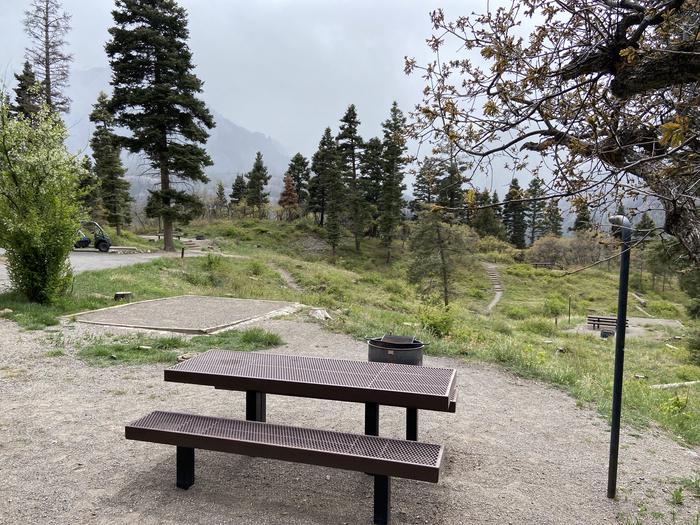 A photo of Site 025 of Loop AMPHITHEATER  at AMPHITHEATER (CO) with Picnic Table, Fire Pit, Tent Pad, Lantern Pole