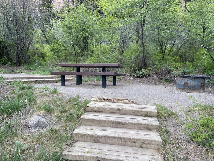 A photo of Site 032 of Loop AMPHITHEATER  at AMPHITHEATER (CO) with Picnic Table, Fire Pit, Tent Pad, Lantern Pole